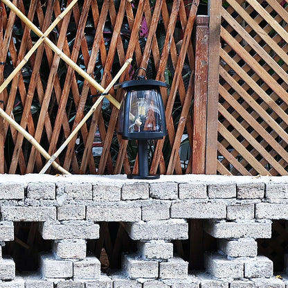 solar LED light installed on the top of a short brick wall