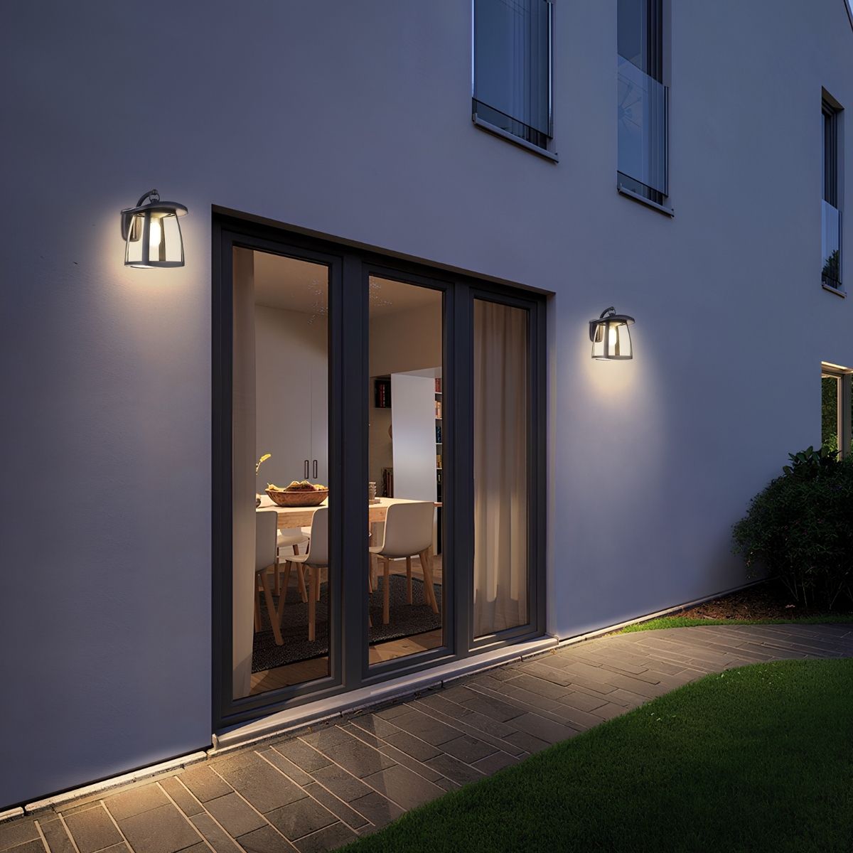 solar LED wall lights installed on the exterior of a home along a small pathway