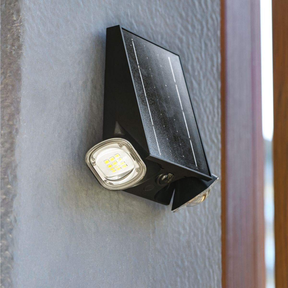solar wall light shown installed outside an entrance door